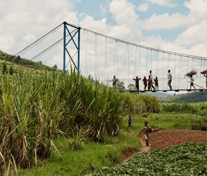 people crossing bridge by bridges to prosperity